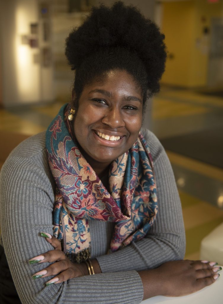 UMass doctoral student Yelana Sims is the curator of “Theater of the Streets: Social Landscapes Through the lens of Jill Freedman,” now on display at the university’s Augusta Savage Gallery.
