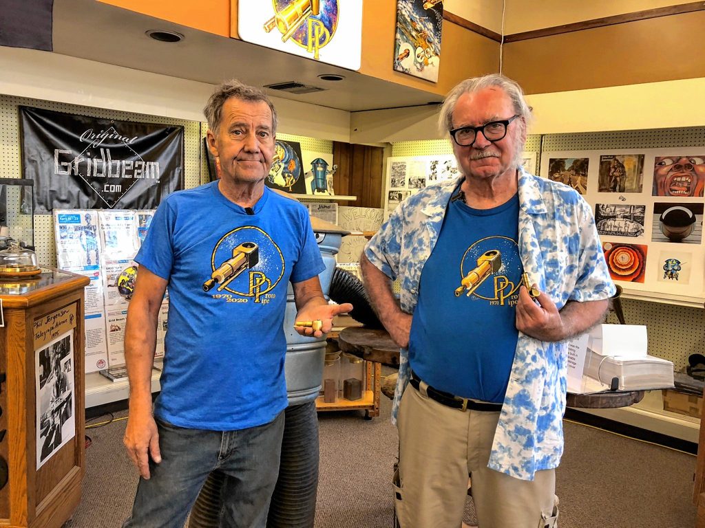 Proto Pipe inventor Phil Jergenson, left, holds a Proto Rocket. His brother Richard Jergenson, the company archivist and a cannabis historian, holds a classic version of the pipe at the Emerald City Cannabis Museum pop-up in Willits, California.