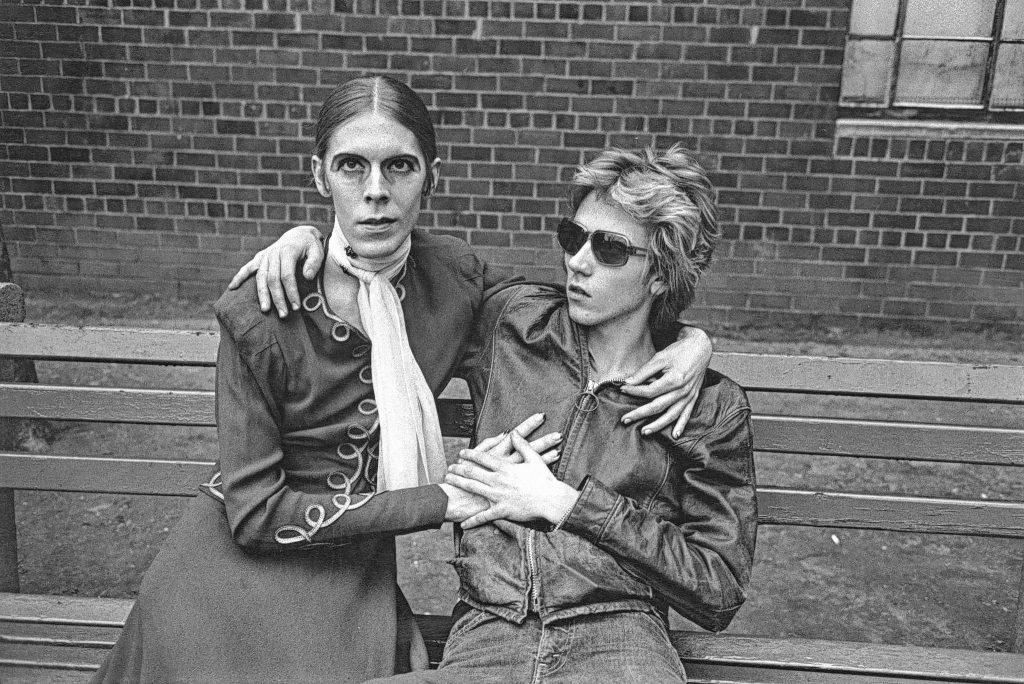 A gay couple sit on a bench in Greenwich Village, New York City, 1973. 
