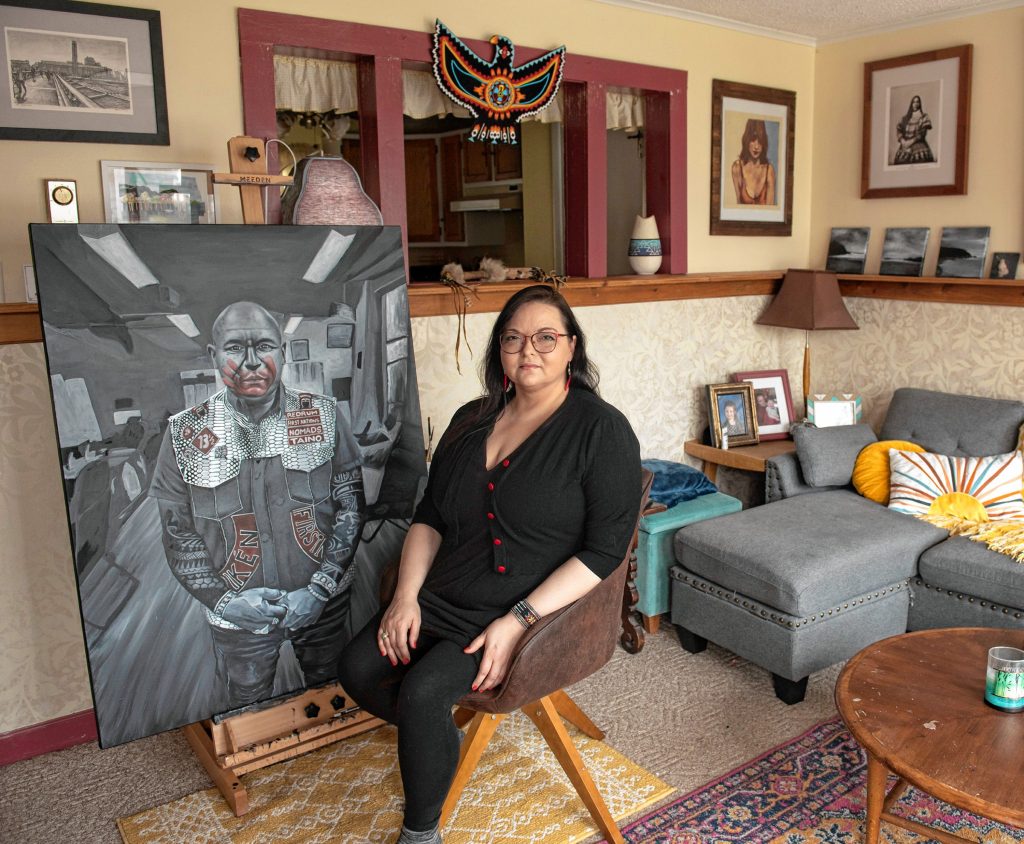 Nayana LaFond in her home in Athol with a portrait she made of Chuck, an advocate in New York City of the MMIW movement: Missing and Murdered Indigenous Women.