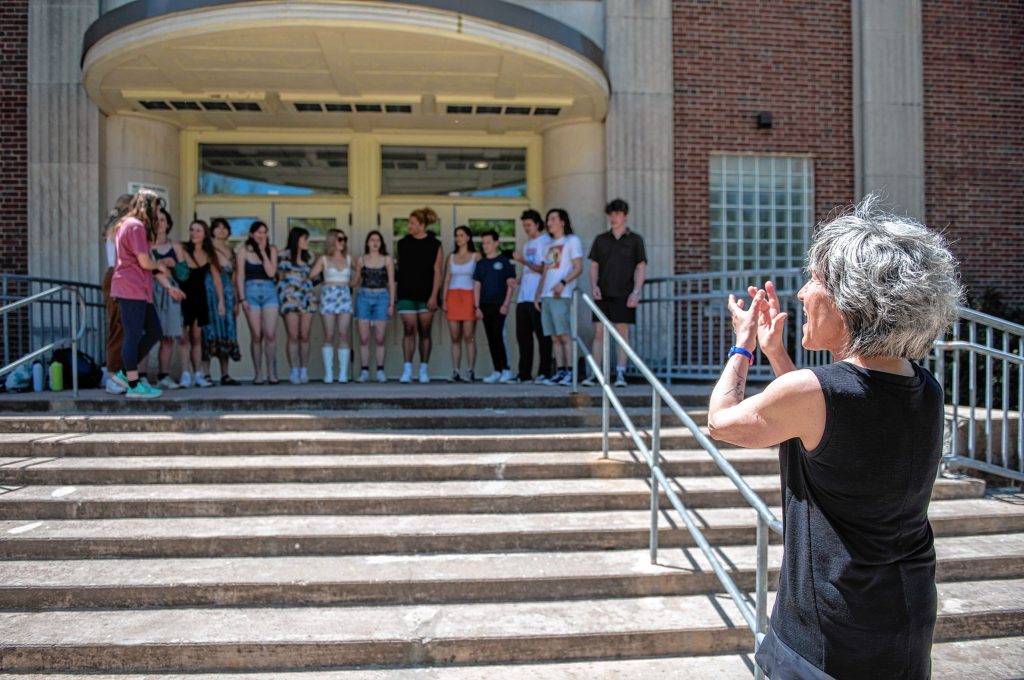 A job well done: Beau Flahive applauds The Northamptones, Northampton High School’s a capella group, after they wrapped a recent rehearsal outside the building by doing Queen’s “Bohemian Rhapsody.” 