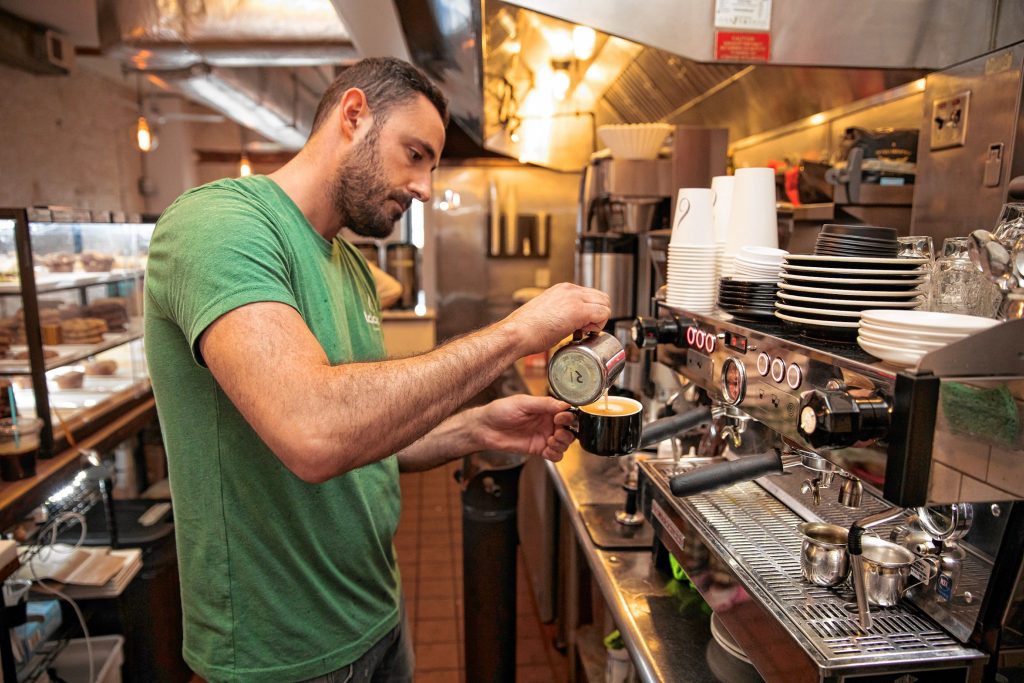 Cafe Balagan co-owner and manager Gil Sasson prepares a drink on Wednesday morning in Northampton.