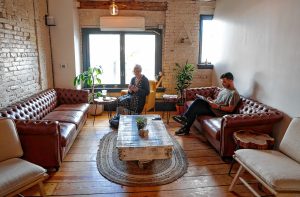 Patrons enjoy the lounge area at Cafe Balagan on Wednesday morning in Northampton. Starting Friday, the cafe will offer late-night service in the space.