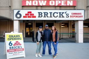 Payton Shubrick, CEO and founder of 6 Brick’s cannabis retail store, right, with her father Fred Shubrick and sister Taylor Shubrick on Tuesday afternoon in Springfield.