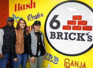 Payton Shubrick, CEO and founder of 6 Brick’s cannabis retail store, middle, with her father Fred Shubrick and sister Taylor Shubrick on Tuesday afternoon in Springfield.