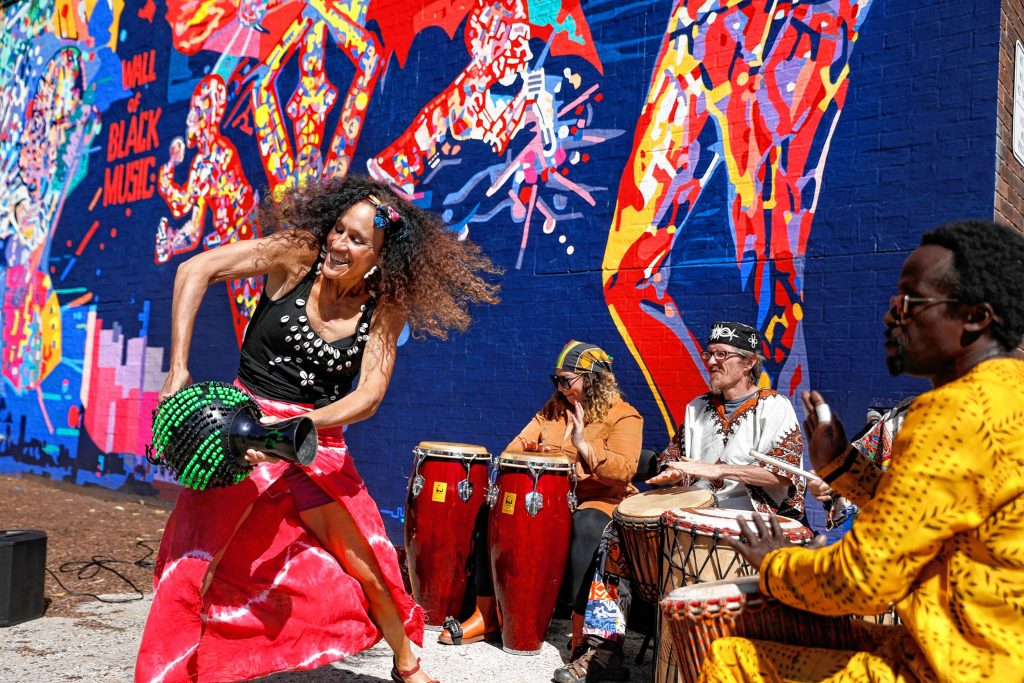 Ammaya Dance and Drum group performs Saturday afternoon during the commemoration ceremony of The Wall of Black Music mural, originally created by Nelson Stevens with his student Clyde Santana, that was recreated by Common Wealth Murals and the Community Mural Institute and is now on view at 1 Montrose Street in Springfield.