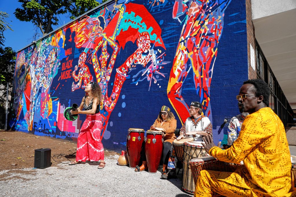 Ammaya Dance and Drum group performs Saturday afternoon during the commemoration ceremony of The Wall of Black Music mural, originally created by Nelson Stevens with his student Clyde Santana, that was recreated by Common Wealth Murals and the Community Mural Institute and is now on view at 1 Montrose Street in Springfield.