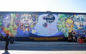 The Tribute to Black Women mural, originally created by her father Nelson Stevens in 1974, that was recreated by Common Wealth Murals and the Community Mural Institute and is now on view at 38 Catherine Street in Springfield.