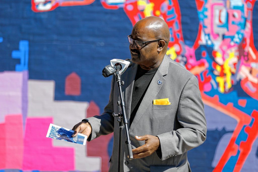 State Rep. Bud L. Williams, D-Springfield, speaks Saturday afternoon during the commemoration ceremony of The Wall of Black Music mural, originally created by Nelson Stevens with his student Clyde Santana, that was recreated by Common Wealth Murals and the Community Mural Institute and is now on view at 1 Montrose Street in Springfield.
