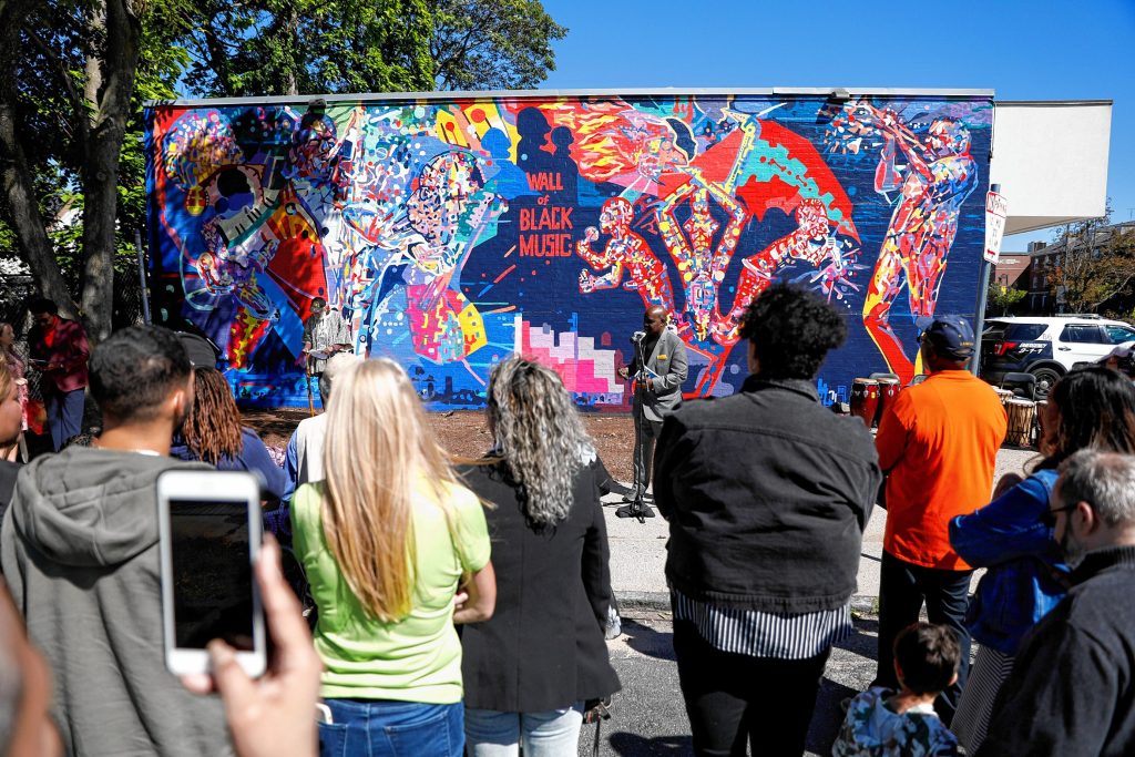 State Rep. Bud L. Williams, D-Springfield, speaks Saturday afternoon during the commemoration ceremony of The Wall of Black Music mural, originally created by Nelson Stevens with his student Clyde Santana, that was recreated by Common Wealth Murals and the Community Mural Institute and is now on view at 1 Montrose Street in Springfield.