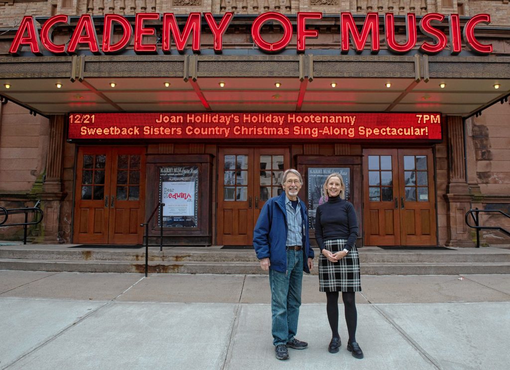 Chris Rohmann stands with Debra J'Anthony, the executive director of the  Academy of Music, where Rohmann has attended many performances for his column in the Advocate. After 36 years, Rohmann has decided to end his run as a theater critic.