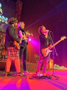 UMass Amherst rockers Reservations@8 — from left, Peter Tuohy, Flynn Duffy, and Tommy Dalton — toured with writer Jeff Kinney this fall to promote his new book and movie.