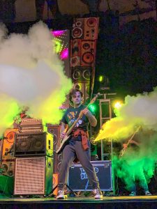 Rock on! UMass Amherst sophomore Tommy Dalton hammers out a riff while touring last month with the band Reservations@8 in support of “Wimpy Kid” writer Jeff Kinney.