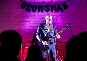 Robert Ives performs with the band Problem With Dragons at the Doomsmas event at the Marigold Theater in Easthampton.