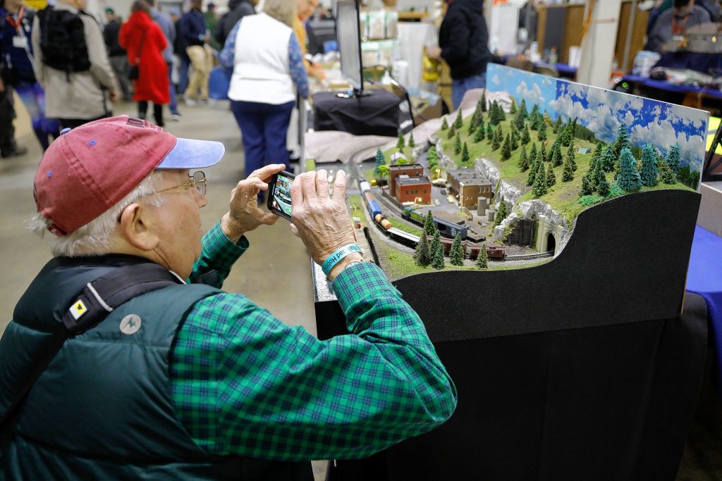 Toby Pelts photographs an exhibit during the annual Railroad Hobby Show produced by the Amherst Railway Society at the Eastern States Exposition grounds in West Springfield.