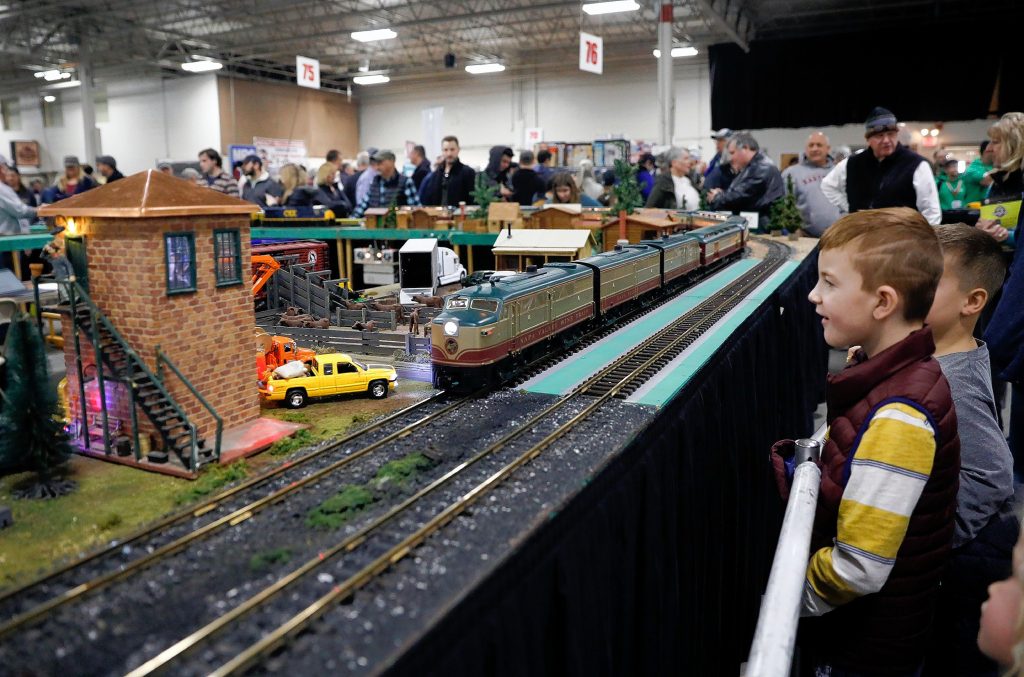Tanner McCarron, 7, eyes a passing model train at the Railroad Hobby Show, produced annually by the Amherst Railway Society at the Eastern States Exposition grounds in West Springfield.
